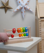 Bajo Sparrow Abacus wooden toy. This abacus has 5 little birds and 5 round counters. These heirloom quality toys by Bajo are part of a wide range of wooden toys available here at Babipur.