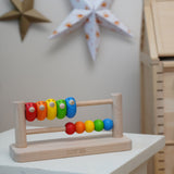 Bajo Sparrow Abacus wooden toy. This abacus has 5 little birds and 5 round counters. These heirloom quality toys by Bajo are part of a wide range of wooden toys available here at Babipur.