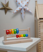 Bajo Sparrow Abacus wooden toy. This abacus has 5 little birds and 5 round counters. These heirloom quality toys by Bajo are part of a wide range of wooden toys available here at Babipur.