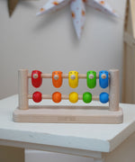 Bajo Sparrow Abacus wooden toy. This abacus has 5 little birds and 5 round counters. These heirloom quality toys by Bajo are part of a wide range of wooden toys available here at Babipur.