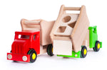 Red and green plastic-free Bajo tipper lorry shape sorter toys on a white background