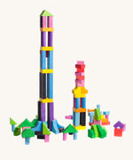 Bajo 102 Blocks. A set of 102 wooden toy building blocks. The blocks have been stacked on top of each other to create a tower. These heirloom quality toys by Bajo are part of a wide range of wooden toys available here at Babipur. 