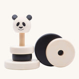 A Bajo Panda Stacker wooden toy  with two of the circle stacking pieces taken off. This black and white stacking toy has four removable rings and a panda head that fit onto a wooden pole and base. These heirloom quality toys by Bajo are part of a wide range of wooden toys available here at Babipur. 