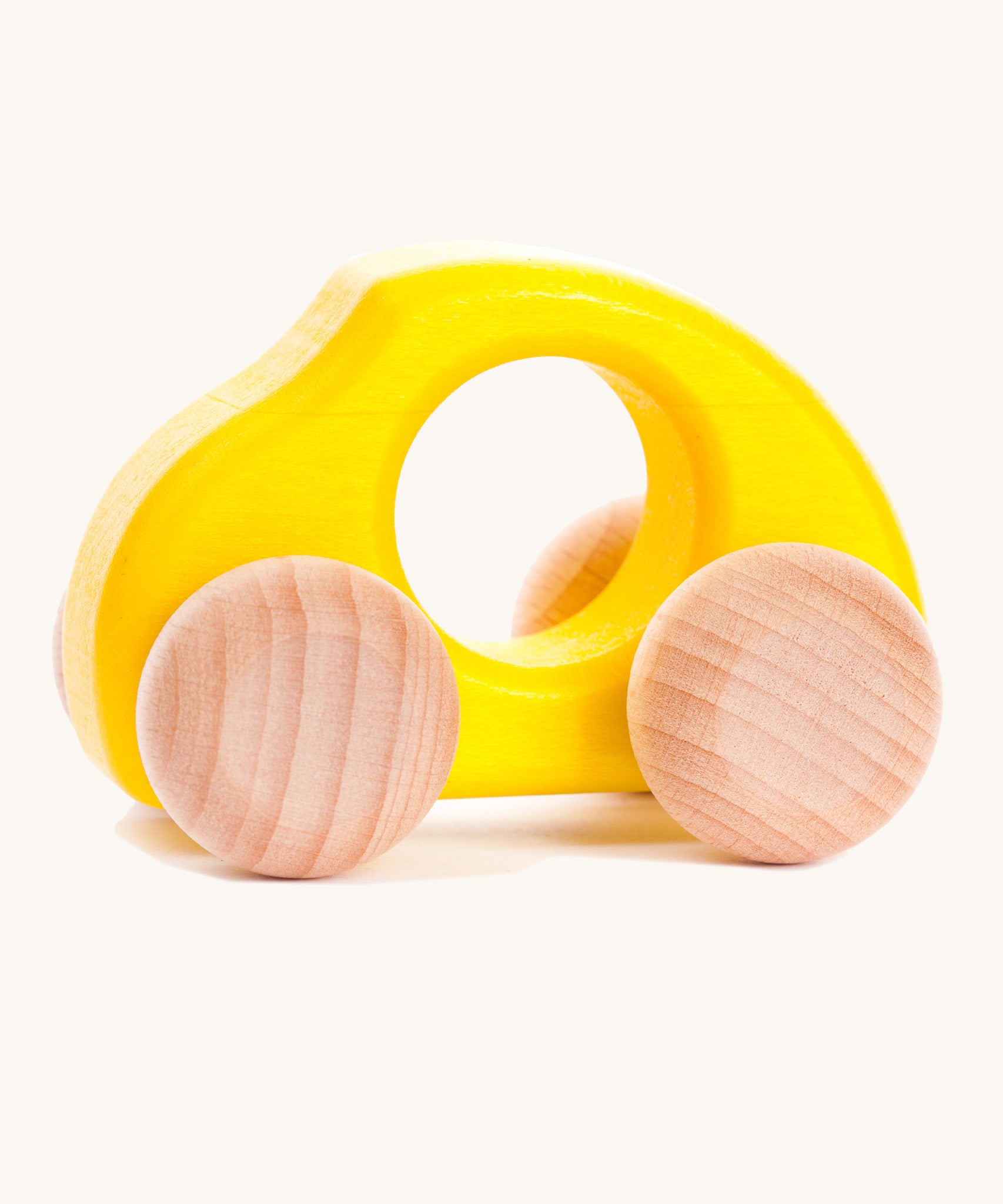 Bajo handmade wooden beetle style car in yellow and available at Babipur features unpainted wheels, can be pushed or pulled along.