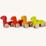A group of Bajo wooden wriggly worms, available at Babipur including a light green, yellow red and orange worn.
