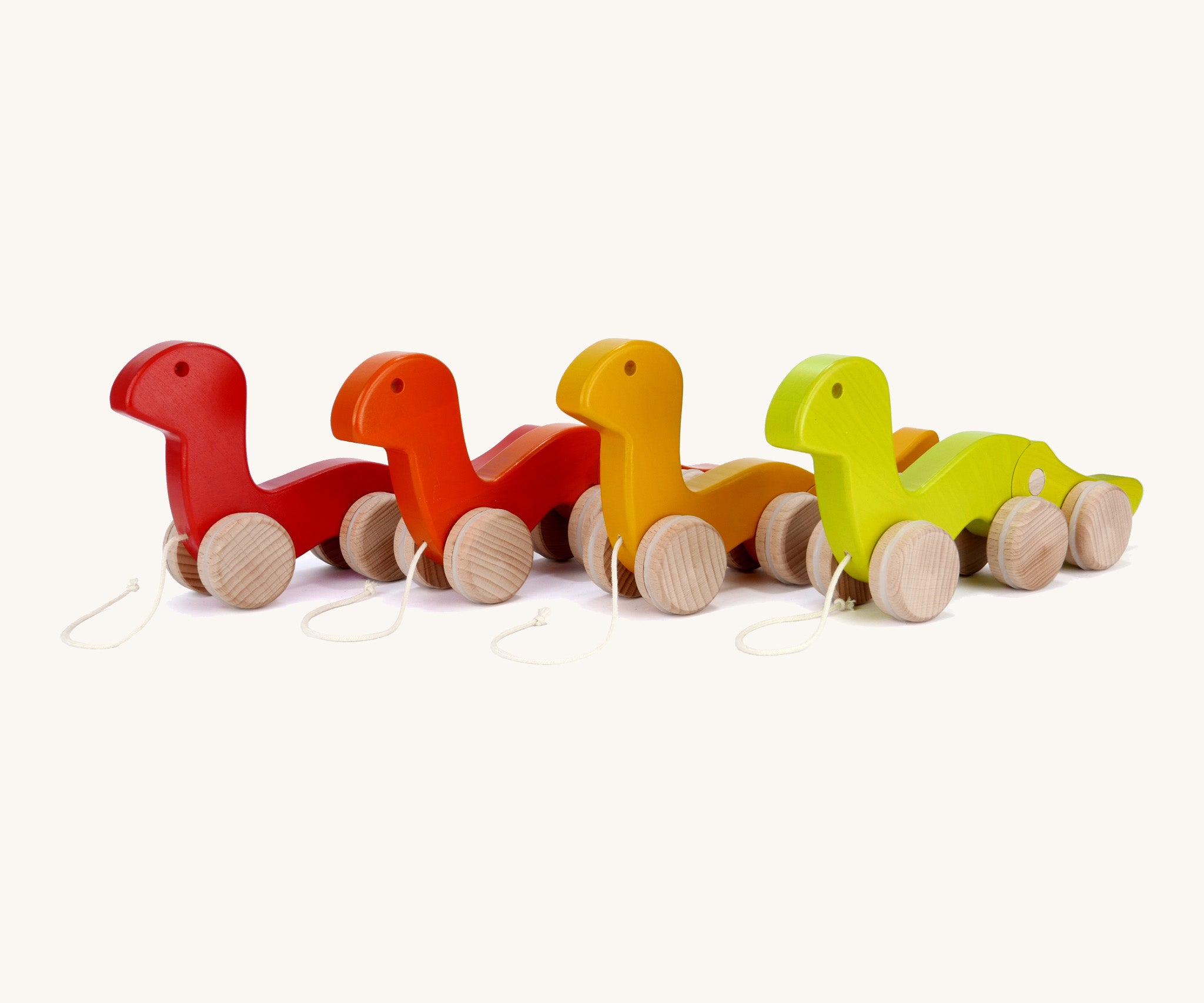 A group of Bajo wooden wriggly worms, available at Babipur including a light green, yellow red and orange worn.