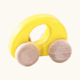 Bajo handmade wooden ellipse car in yellow with a  oval cut out in the center for grip and unpainted wheels