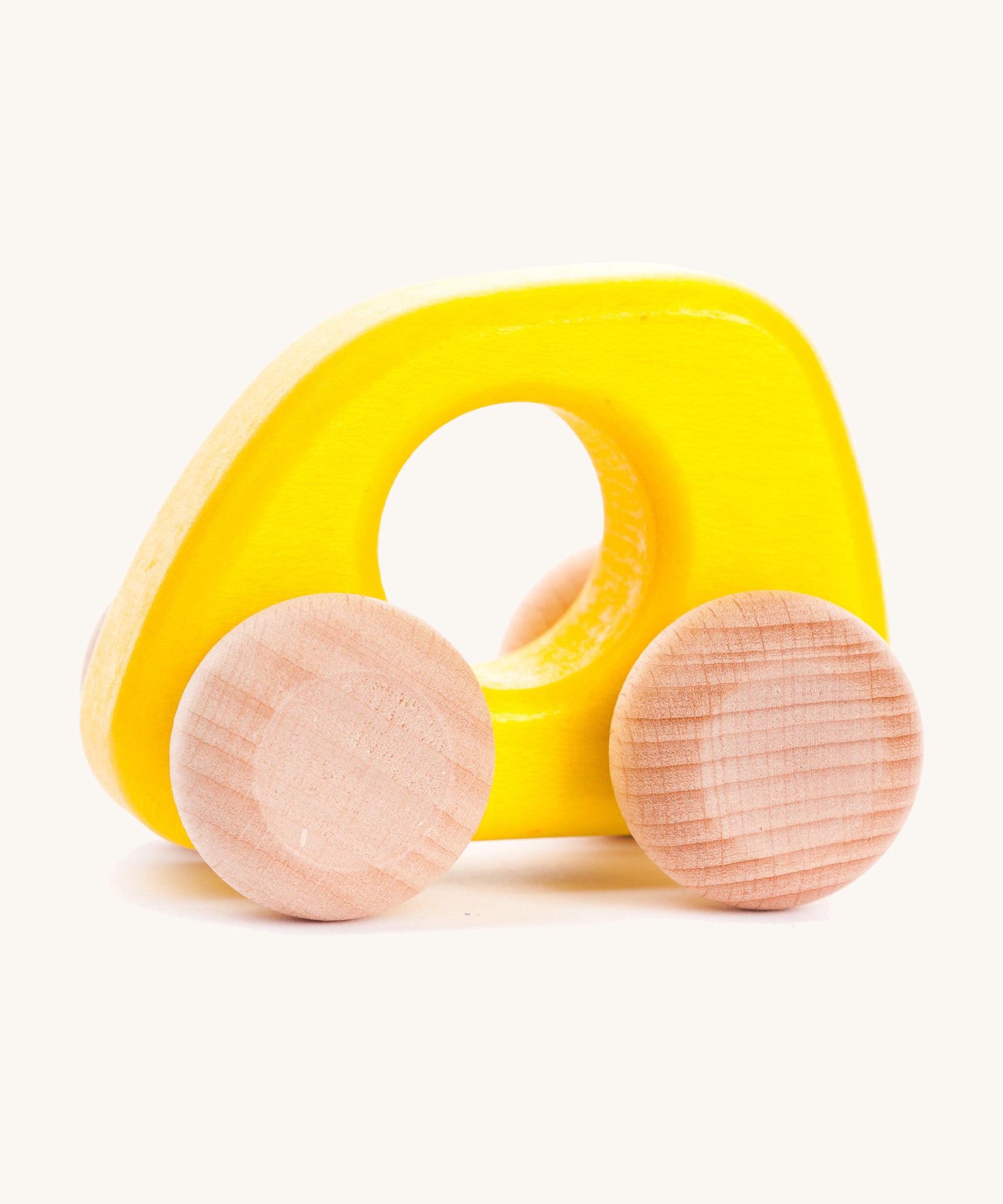 Bajo hand made wooden yellow mini style car available at Babipur. Features unpainted wheels and a cut out hole for easy grabbing