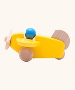 Bajo wooden yellow plane with a blue pilot, unpainted wheels, propellors and rudder