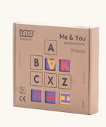 Bajo me & you alphabet blocks. Set of 12 wooden 4cm cube blocks with letters on each side in their box.