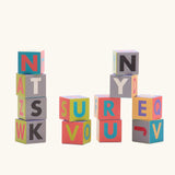 Bajo me & you alphabet blocks. Set of 12 wooden 4cm cube blocks with letters on each side.