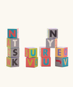 Bajo me & you alphabet blocks. Set of 12 wooden 4cm cube blocks with letters on each side.