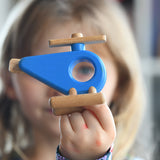 Child holding the Bajo Helicopter in Blue