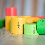 Bajo Fraction Set Maths Resource Learning Toy showing wooden Bajo fraction blocks in yellow 1/5