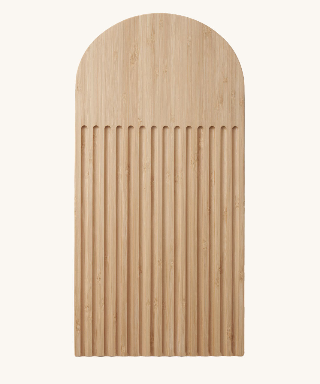 A Bambu bamboo Arch Bread Board with crumb catching ridges