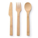 Fork & Spoon Set pictured on a cotton napkin on a patterned tablecloth