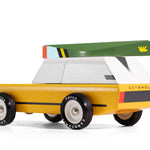 Picture of magnetic wooden canoe toy attached to a Candylab Cotswold Car.