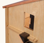 Beck Holzspielzeug wooden farm barn  toy side showing upper sliding chicken window above the dark stained chicken staircase.