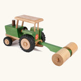 Beck Holzspielzeug traditional wooden toy tractor pulling farm roller attachment, with Spiel Gut award sticker on the back. 