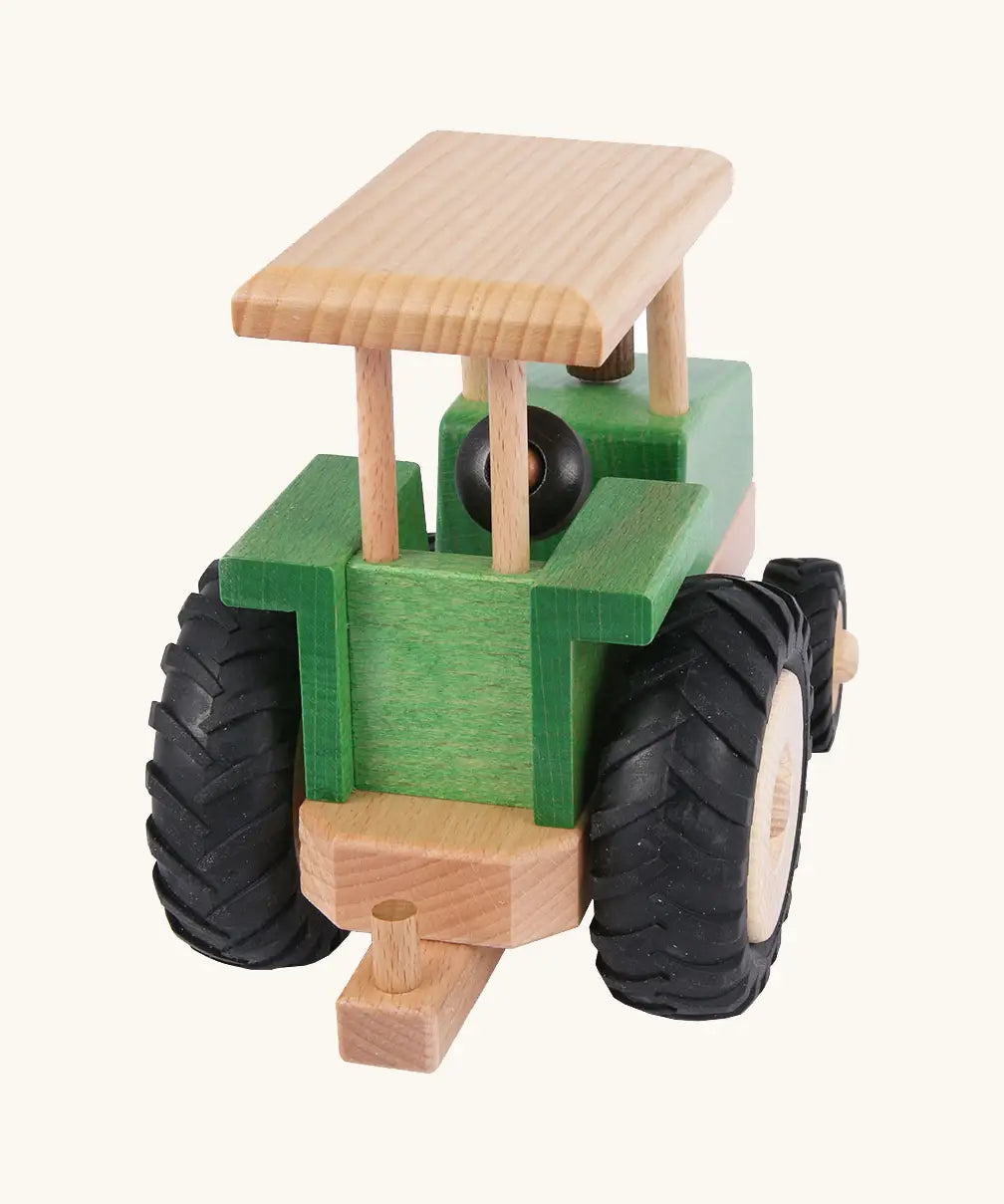 Back of Beck Holzspielzeug steerable wooden toy tractor, showing working towbar that connects Beck trailers and farm accessories.