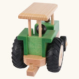 Back of Beck Holzspielzeug steerable wooden toy tractor, showing working towbar that connects Beck trailers and farm accessories.