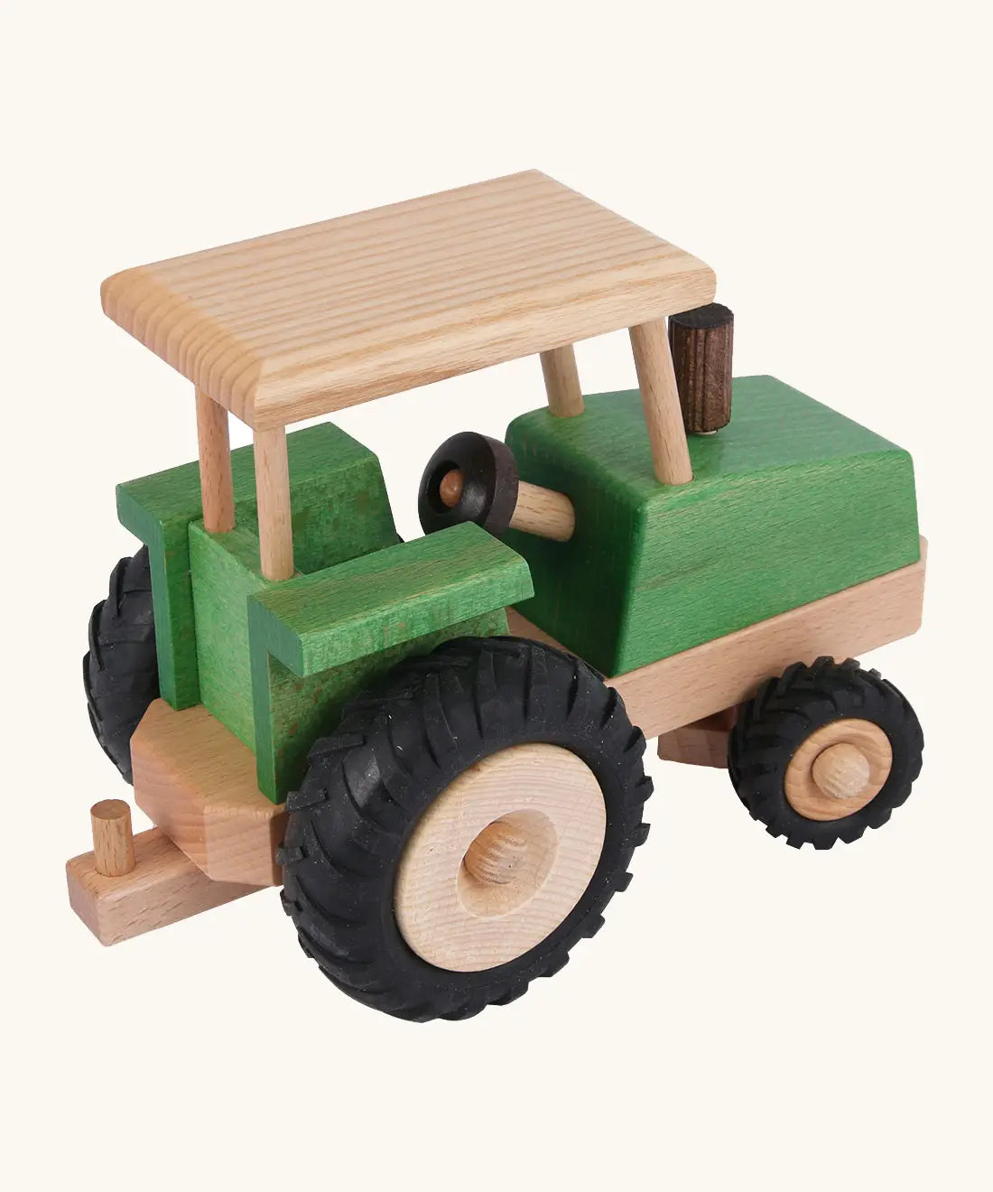 Side of Beck Holzspielzeug steerable wooden toy tractor, showing natural wood  grain, green stained body, and chunky rubber wheels.