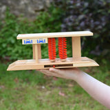 Beck wooden toy car wash in a child's hand.