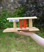 Beck wooden toy car wash in a child's hand.