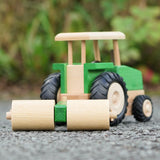 Beck Holzspielzeug wooden toy tractor with farm roller attachment, for farm small world play.