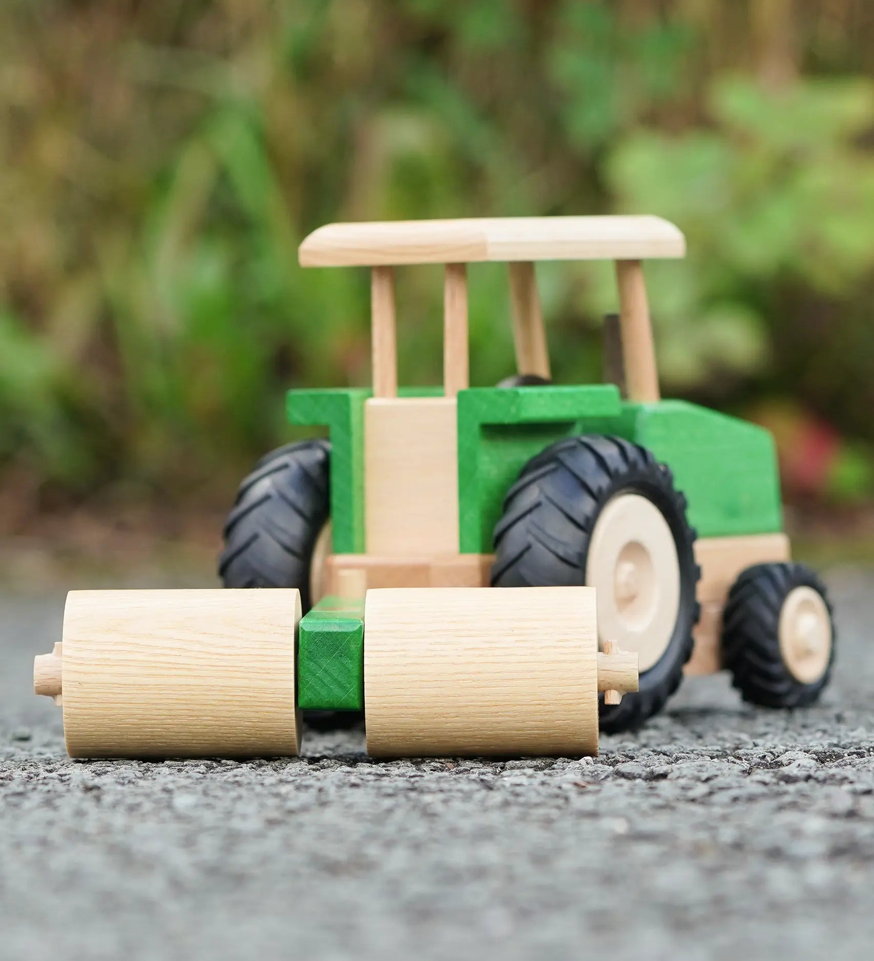 Beck Holzspielzeug wooden toy tractor with farm roller attachment, for farm small world play.