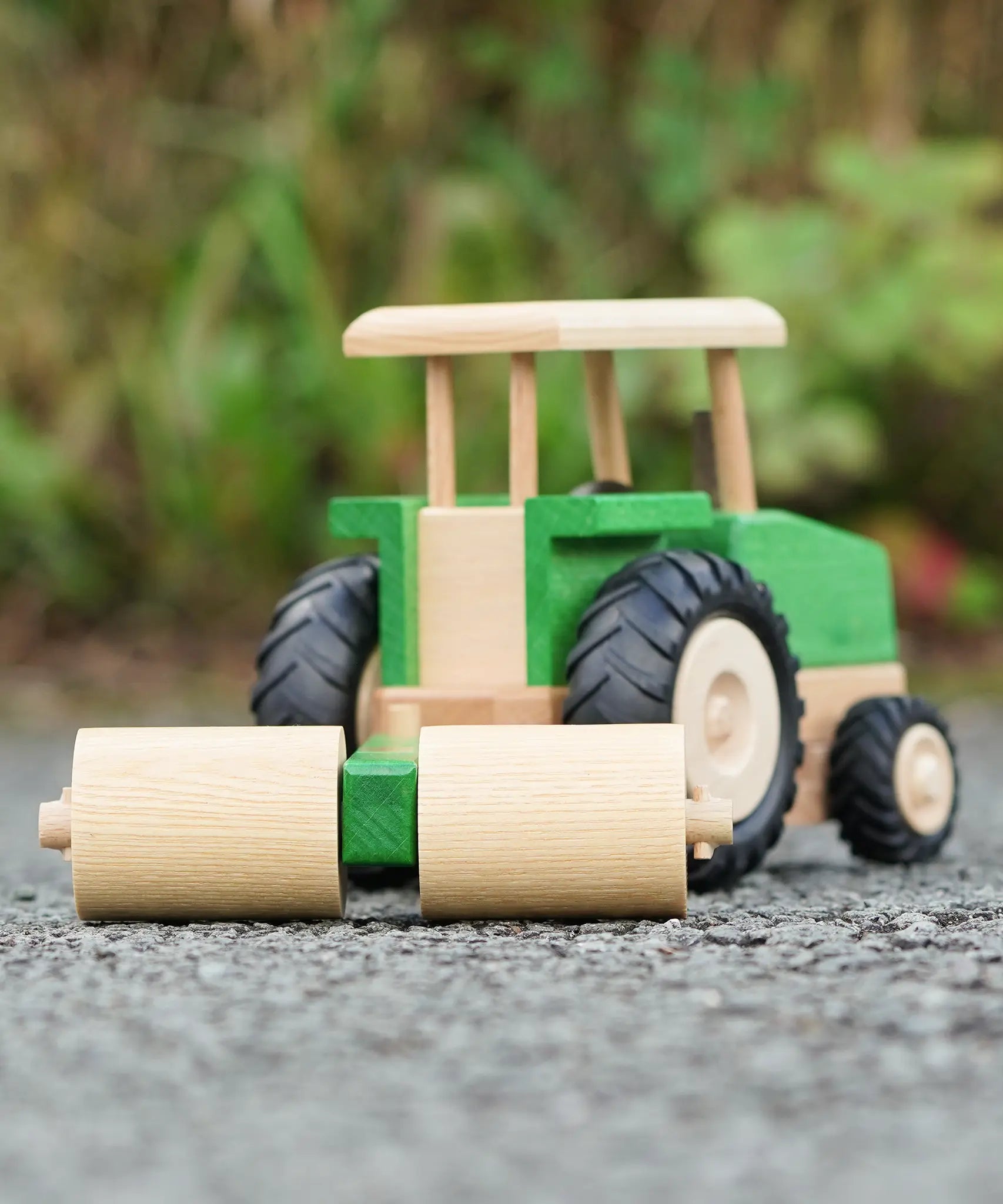 Beck Holzspielzeug wooden toy tractor with farm roller attachment, for farm small world play.