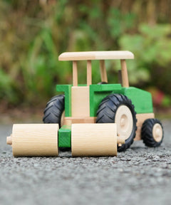 Beck Holzspielzeug wooden toy tractor with farm roller attachment, for farm small world play.