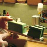 Artisan toymaker in the process of hand making the Beck wooden toy tractor in their German workshop.