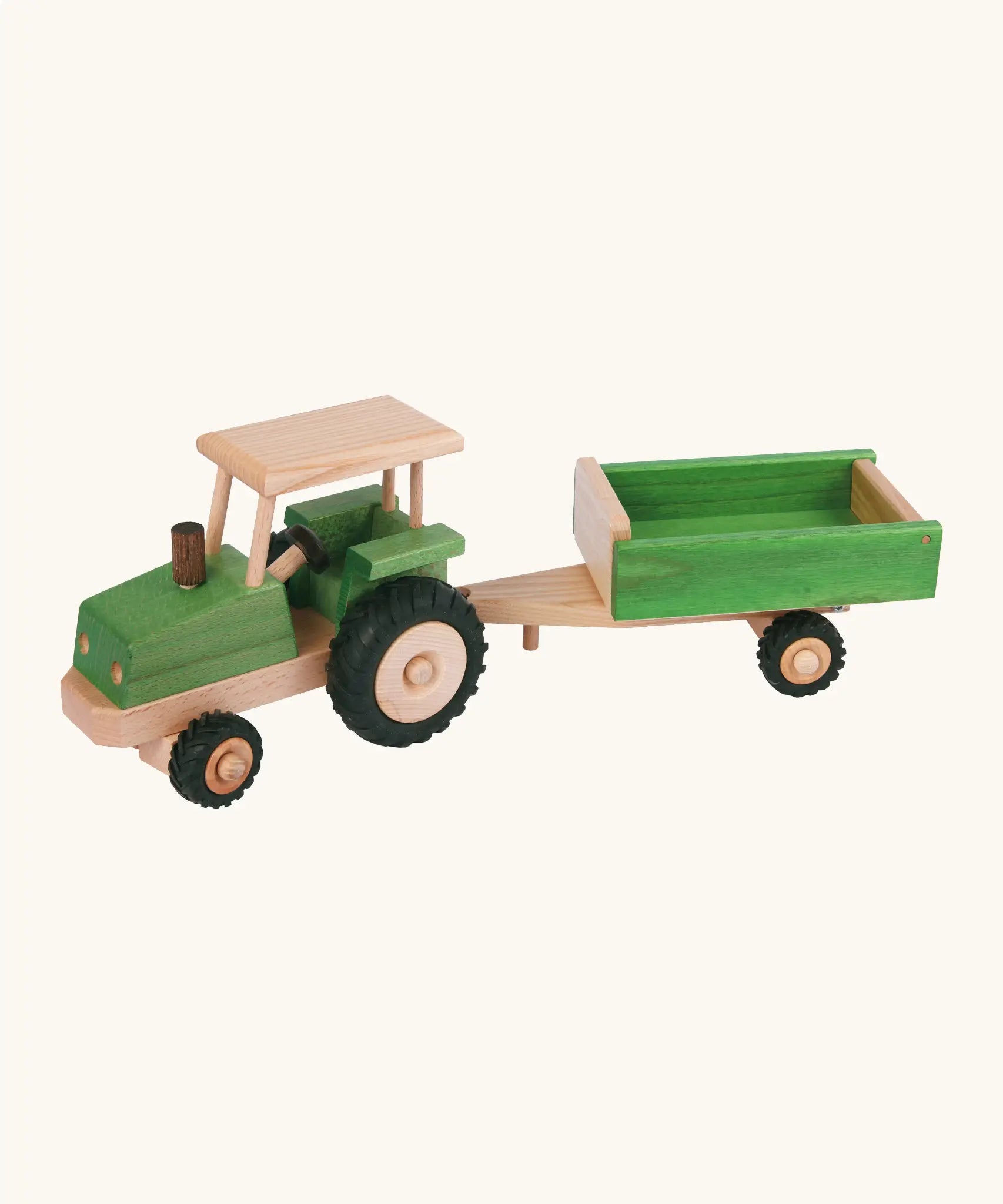 Beck green wooden tractor with a working steering wheel and black rubber tyres with a trailer hitched on the back