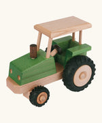 Beck green wooden tractor with a working steering wheel and black rubber tyres