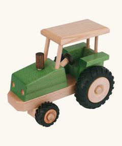 Beck green wooden tractor with a working steering wheel and black rubber tyres