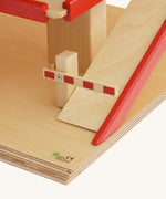 A close up of the barrier on the bottom of the ramp on the Beck Holzspielzeug Wooden Multi-Storey Car Park for Toy Cars. This wooden toy car park is part of a wide range of toy vehicles and accessories available at Babipur.