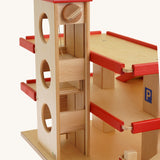 A close up of the car lift on the Beck Holzspielzeug Wooden Multi-Storey Car Park for Toy Cars. This wooden toy car park is part of a wide range of toy vehicles and accessories available at Babipur.