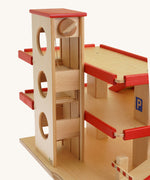 A close up of the car lift on the Beck Holzspielzeug Wooden Multi-Storey Car Park for Toy Cars. This wooden toy car park is part of a wide range of toy vehicles and accessories available at Babipur.