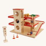 Beck Holzspielzeug Wooden Multi-Storey Car Park for Toy Cars shown with cars and accessories that are available to purchase separately. This wooden toy car park is part of a wide range of toy vehicles and accessories available at Babipur.