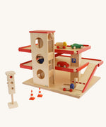 Beck Holzspielzeug Wooden Multi-Storey Car Park for Toy Cars shown with cars and accessories that are available to purchase separately. This wooden toy car park is part of a wide range of toy vehicles and accessories available at Babipur.