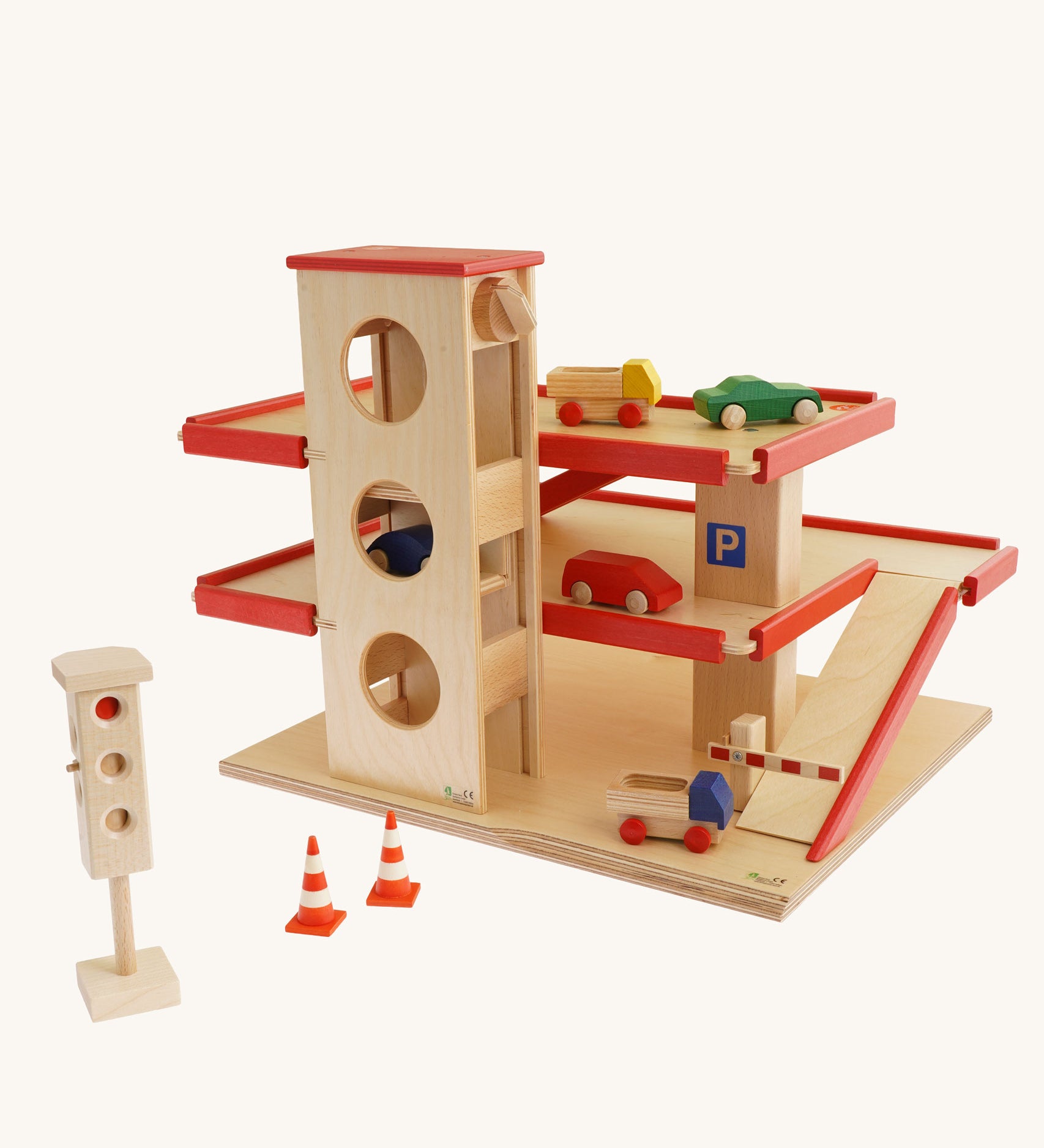 Beck Holzspielzeug Wooden Multi-Storey Car Park for Toy Cars shown with cars and accessories that are available to purchase separately. This wooden toy car park is part of a wide range of toy vehicles and accessories available at Babipur.