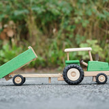 Beck Holzspielzeug wooden toy tractor and tipping trailer attachment, for farm small world play.