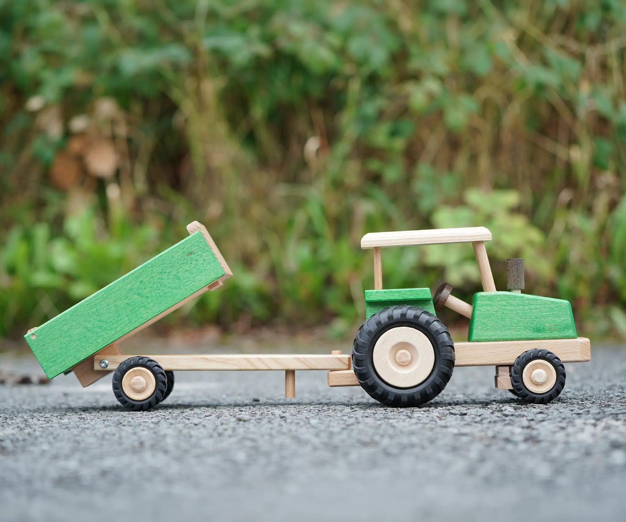 Beck Holzspielzeug wooden toy tractor and tipping trailer attachment, for farm small world play.