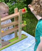 A close up of children playing with the Beck Ball Run Musical Track.