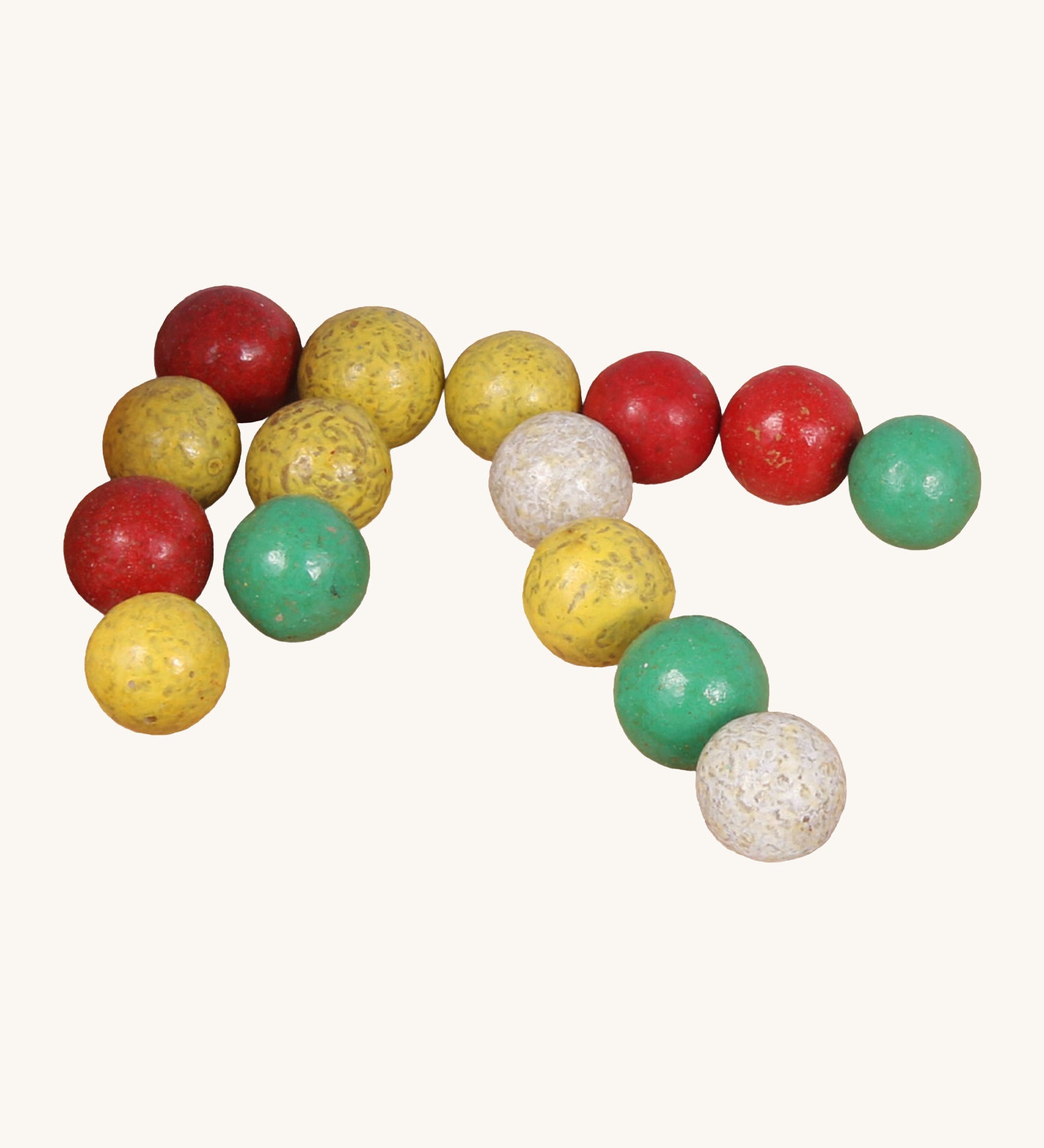 A set of different coloured clay Beck Toys marbles