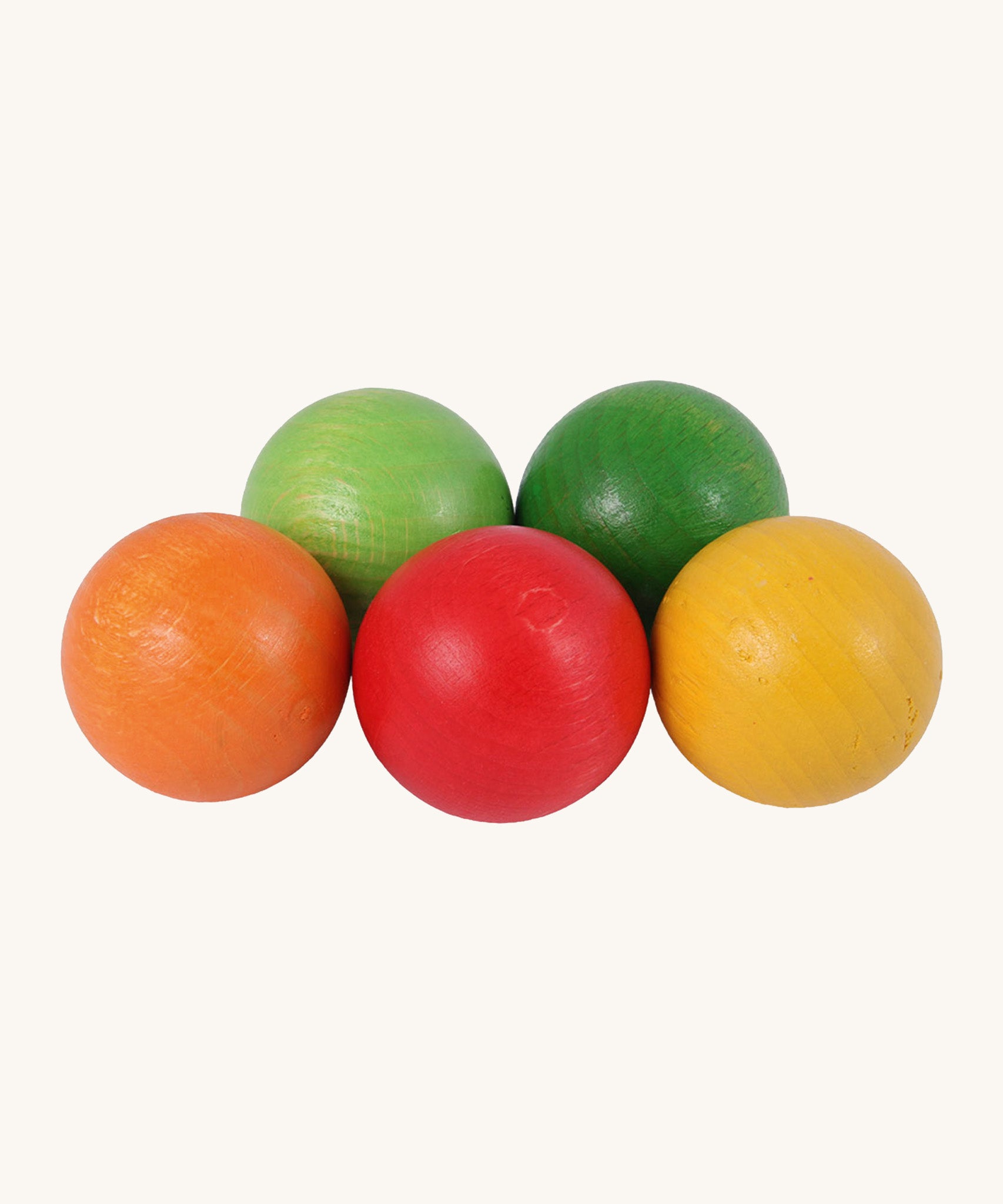 Beck Toys wooden 45mm balls for balls runs. Showing a light green, dark green, orange red and yellow ball.