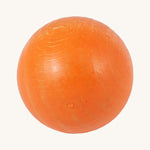 A close up of the orange ball from the Beck Toys wooden ball set