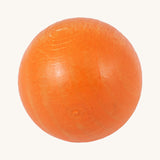A close up of the orange ball from the Beck Toys wooden ball set