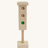 Beck Holzspielzeug Wooden Traffic Light Toy. The side featured shows the the red, amber and green lights. This wooden traffic light is part of a wide range of toy vehicles and accessories available at Babipur.